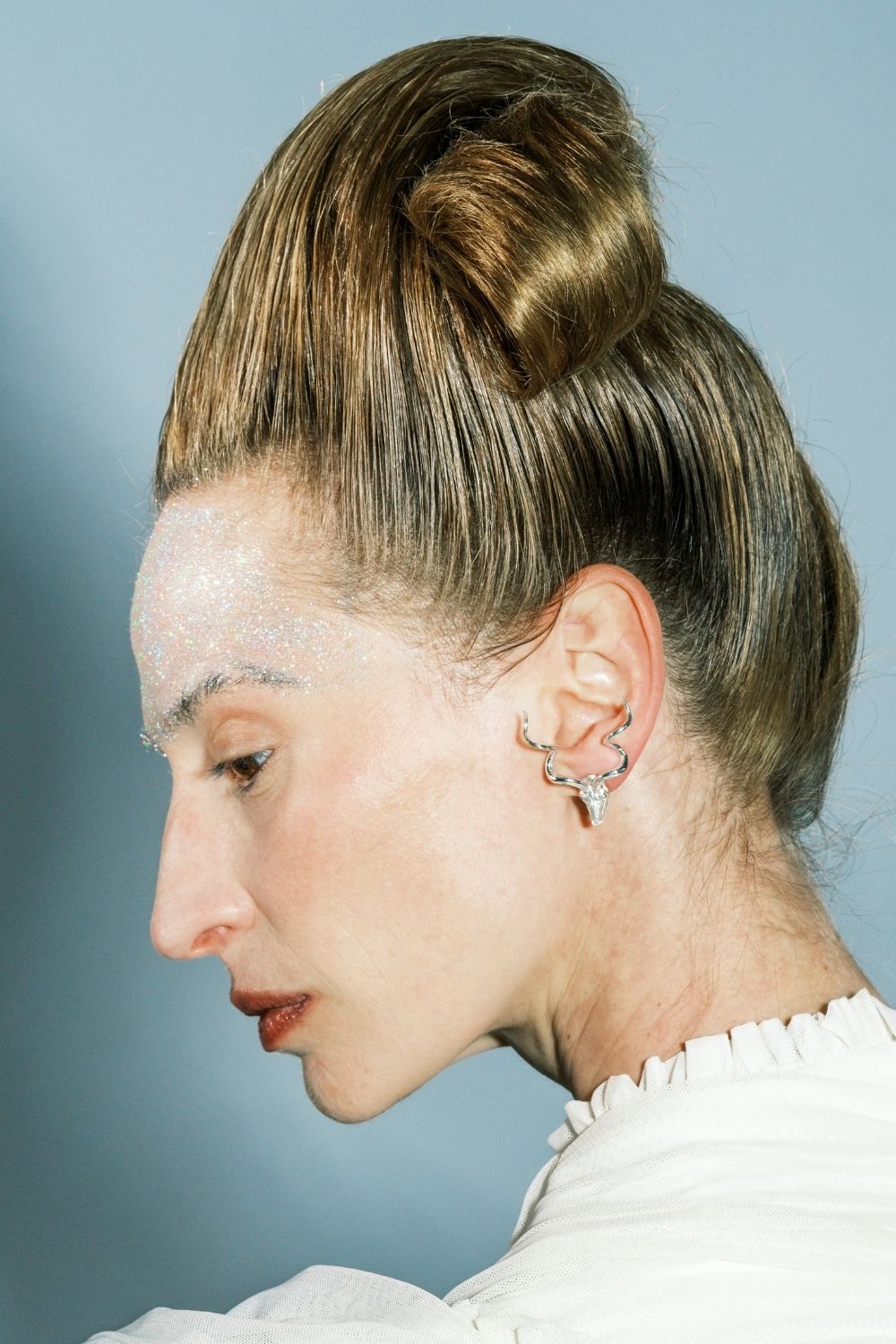 Woman wearing Bullish Pearl Earrings by Piayuli