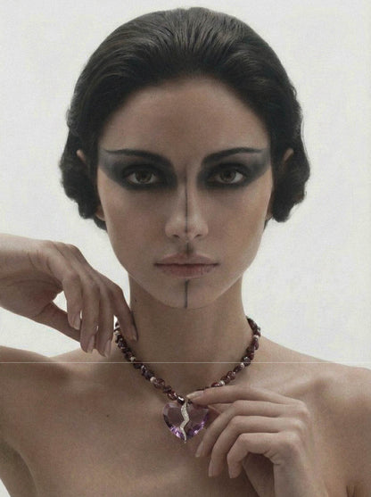 Completed Hearts Garnet Necklace worn on neck with elegant and minimal style
