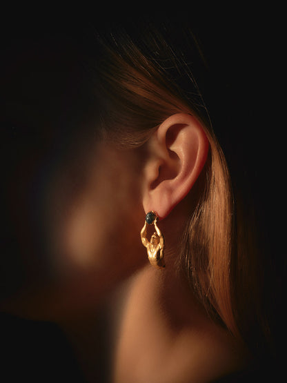 Woman wearing Atlas Earrings with natural star sapphire