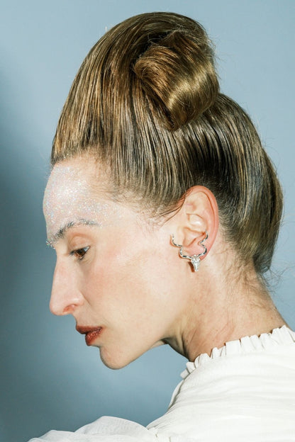 Woman wearing Bullish Pearl Earrings by Piayuli