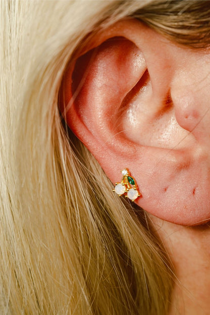 Close-up of Cherry baby earrings with gemstone details