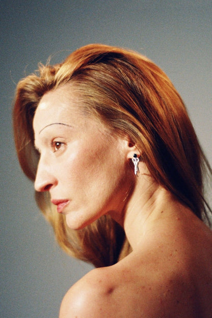 
Woman wearing Daphne and Apollo Earrings by Piayuli