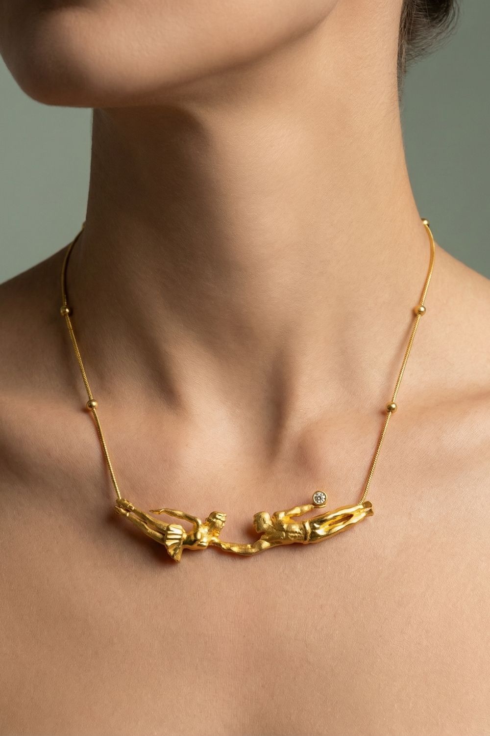 Artistic embrace pendant on the Falling Into You Necklace