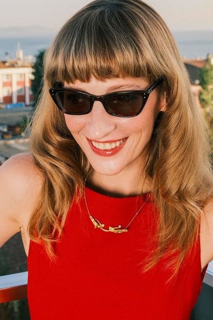 Model wearing the Falling Into You Necklace by Piayuli