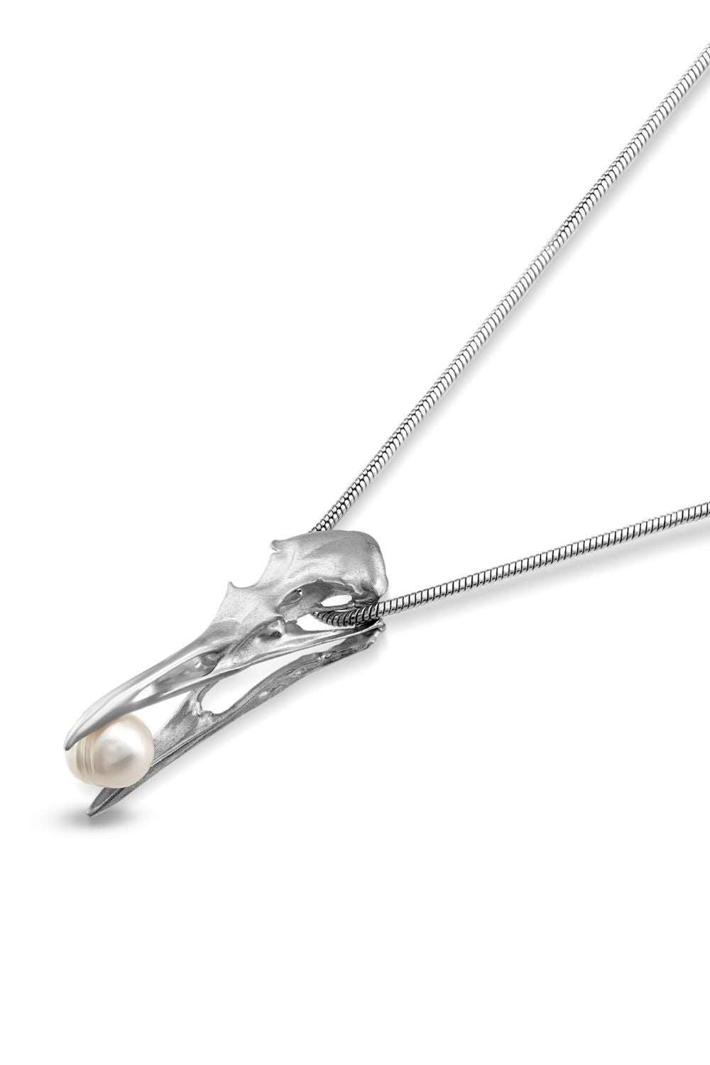 Symbolic detail on the Freedom Pearl Necklace inspired by transformation