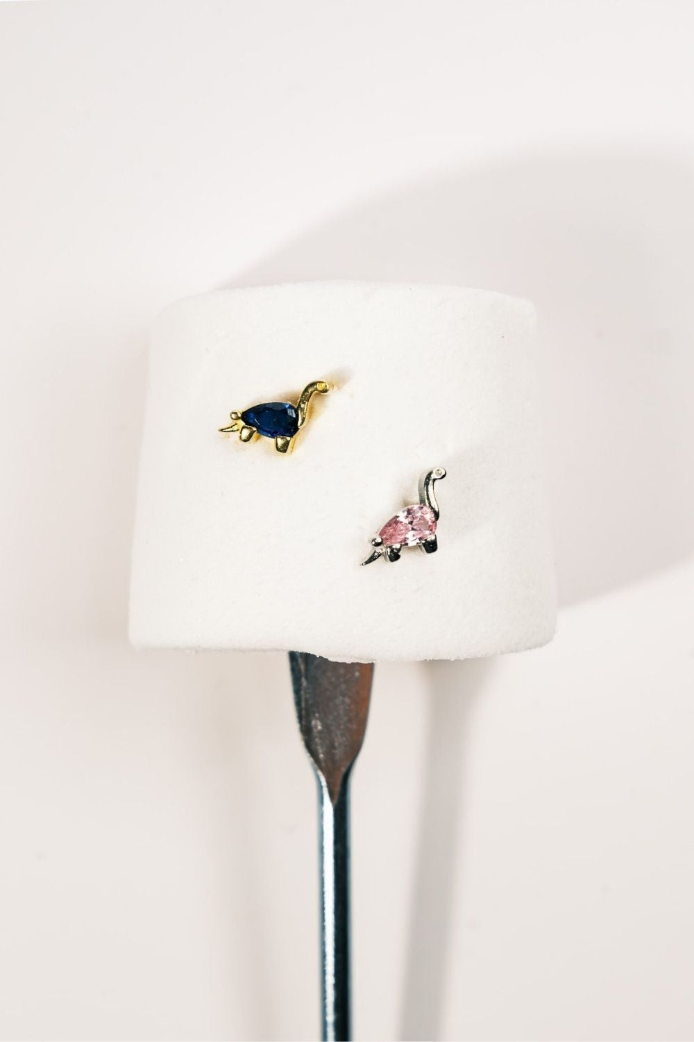 Profile view of Pink Dinosaur Baby Earrings by Piayuli